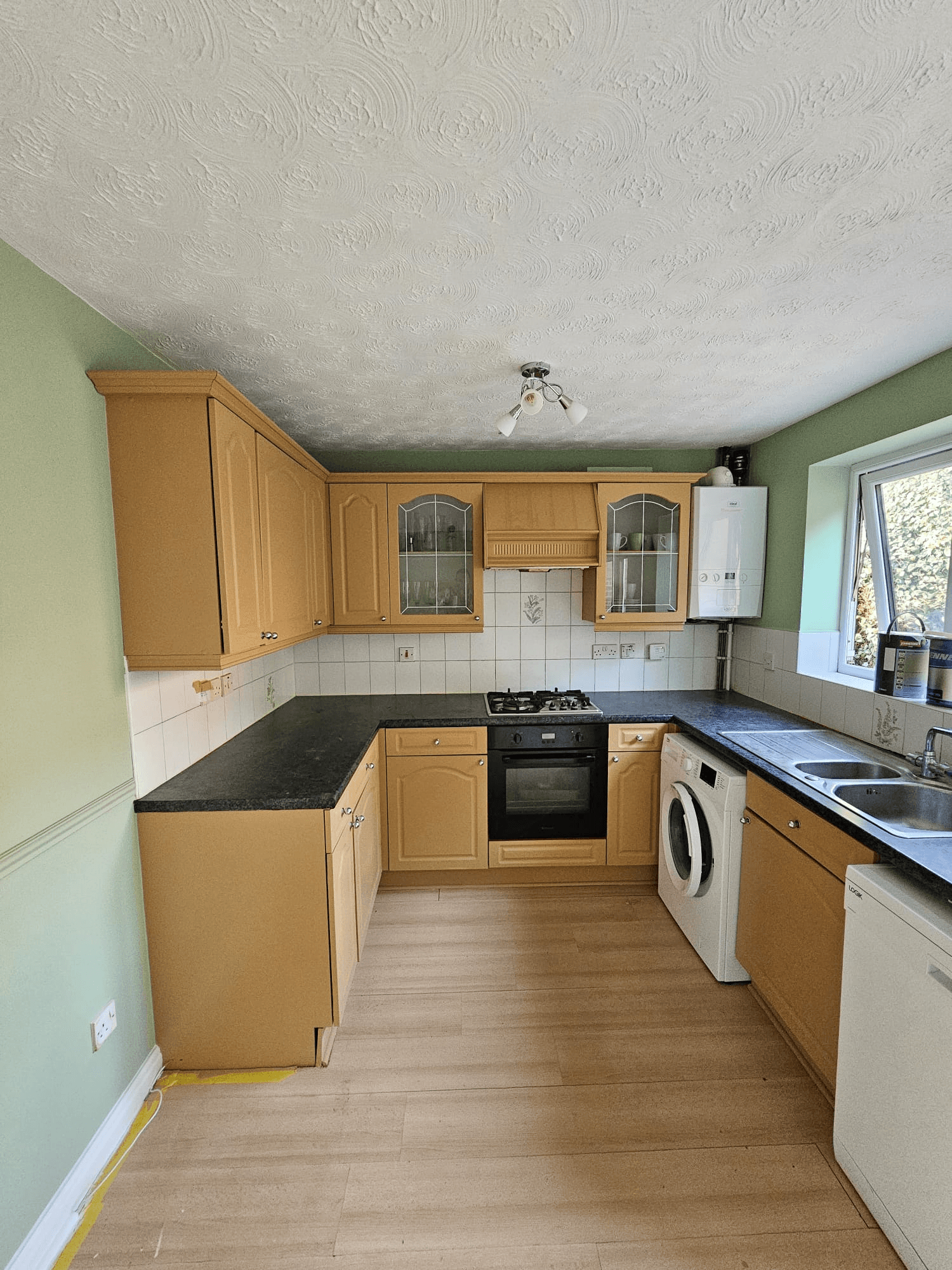 Kitchen before respray Sheffield — original oak cabinet colour