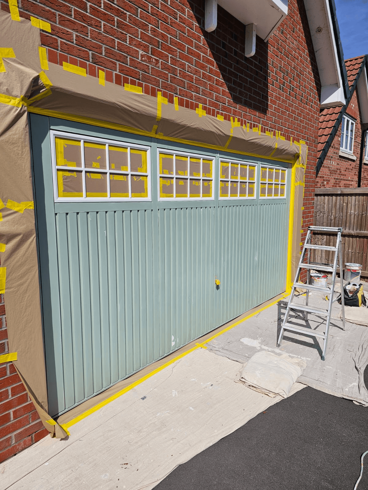 Garage door respray Sheffield — sage green finished result
