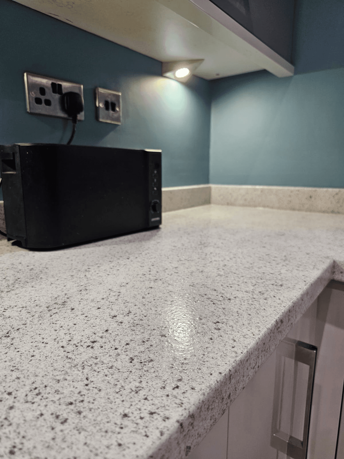 Kitchen worktop respray Sheffield — white granite resin corner detail