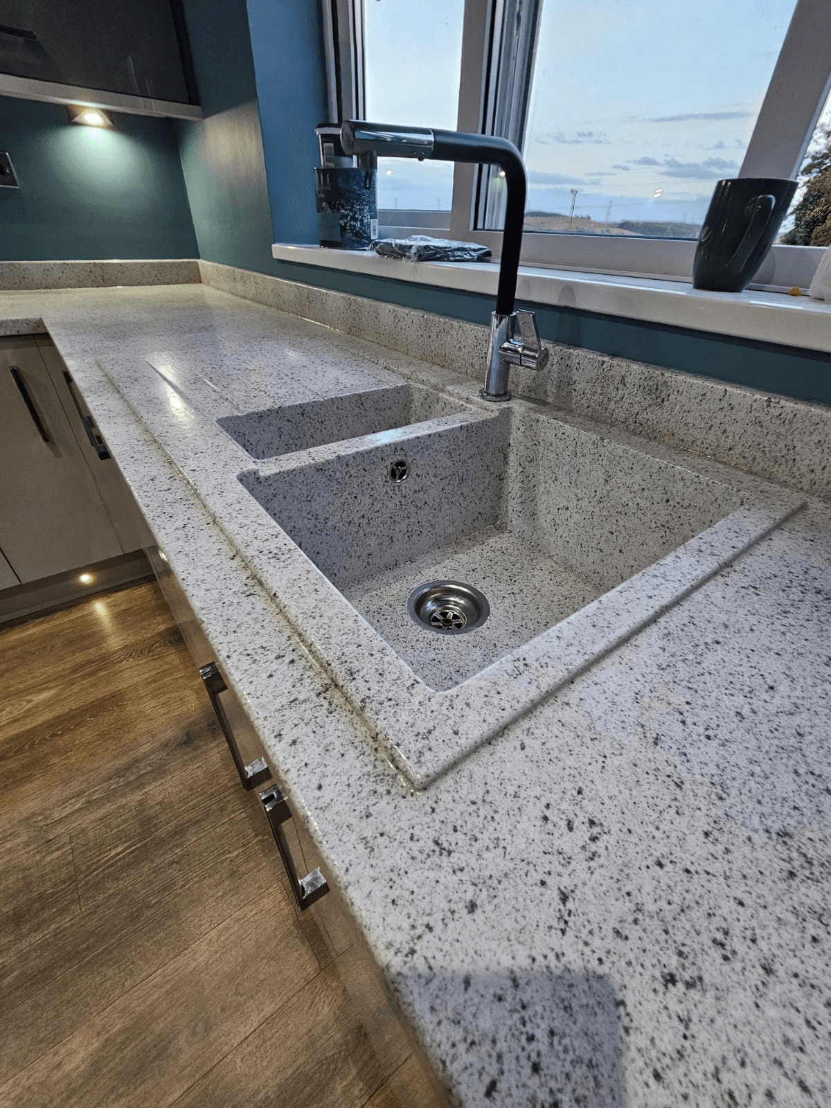 Kitchen worktop respray Sheffield — white granite resin integrated sink detail